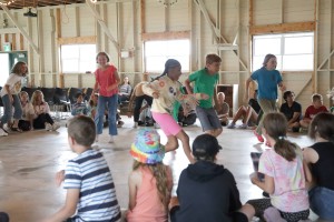 Junior campers playing a game in the auditorium
